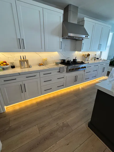 Kitchen remodeling work with new cabinetry, counters and flooring