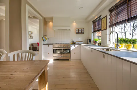 Kitchen remodel photo with island, counters and finished interior details