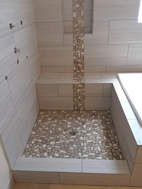 Bathroom remodeling project photo showing shower, tile or vanity work
