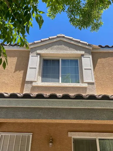HOA violation repair project photo showing exterior stucco, paint or property correction work